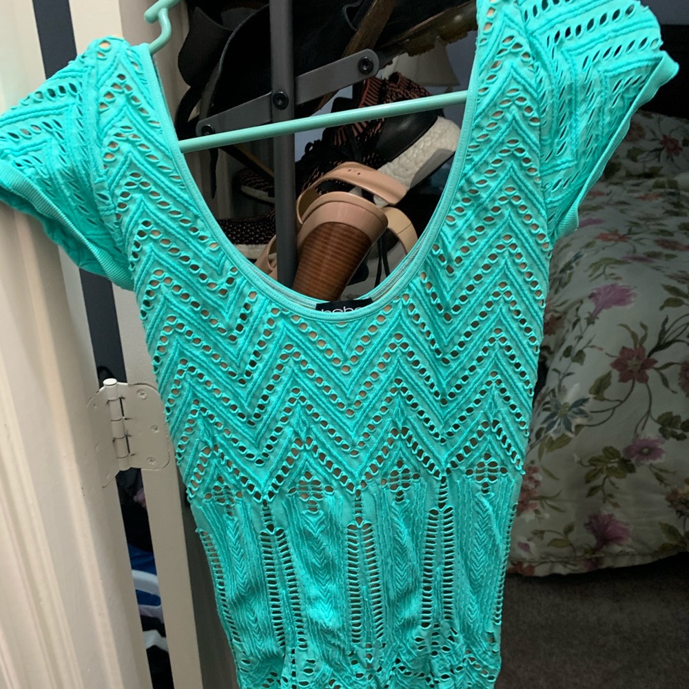 Turquoise Bebe dress never worn M/L